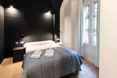 Cama o camas de una habitación en Apartamentos Turísticos DE LA BERNARDA
