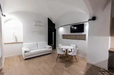 Una televisión o centro de entretenimiento en Apartamentos Turísticos DE LA BERNARDA