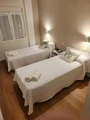 Cama o camas de una habitación en Hostal CASA FRAN