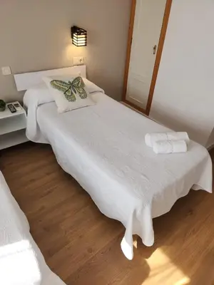 Cama o camas de una habitación en Hostal CASA FRAN