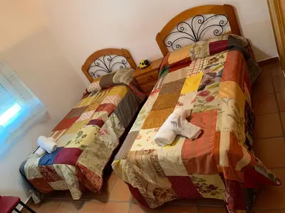 Cama o camas de una habitación en APARTAMENTO TURÍSTICO EL ESQUILÓN