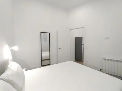 Cama o camas de una habitación en Apartamentos Vacceas by gaiarooms