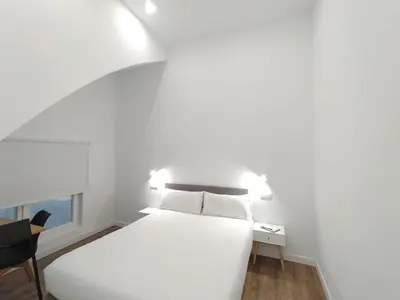 Cama o camas de una habitación en Apartamentos Vacceas by gaiarooms