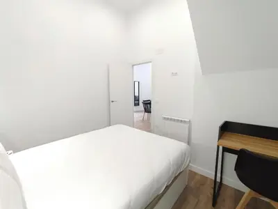 Cama o camas de una habitación en Apartamentos Vacceas by gaiarooms