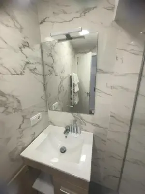 Un baño de Apartamentos Vacceas by gaiarooms