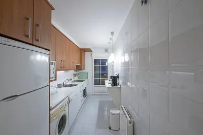 Una cocina o zona de cocina en Apartamento Tíbula Sur Parking