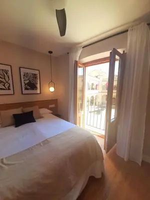 Cama o camas de una habitación en VuT. El Balcón de la Plaza - B.