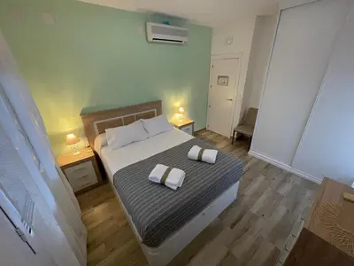 Cama o camas de una habitación en Apartamento Casa Vivian