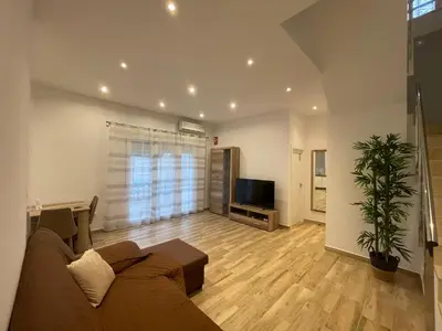Una televisión o centro de entretenimiento en Apartamento Casa Vivian