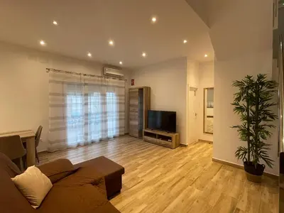 Una televisión o centro de entretenimiento en Apartamento Casa Vivian