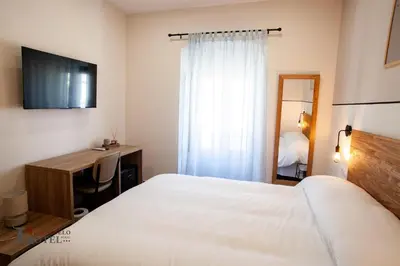 Cama o camas de una habitación en Hotel Rural el Turuñuelo