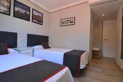 Cama o camas de una habitación en Hostería El Bodegón De Gredos
