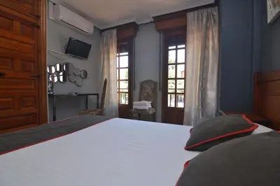 Cama o camas de una habitación en Hostería El Bodegón De Gredos