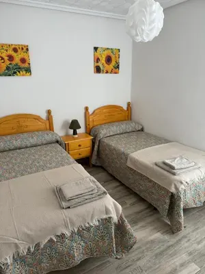 Cama o camas de una habitación en Piso Los Jardines