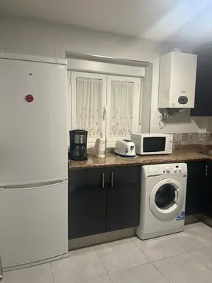 Una cocina o zona de cocina en Piso Los Jardines
