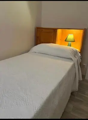 Cama o camas de una habitación en Piso Los Jardines