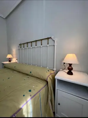 Cama o camas de una habitación en Piso Los Jardines