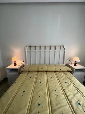 Cama o camas de una habitación en Piso Los Jardines