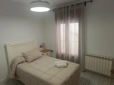 Cama o camas de una habitación en Al-Qazeres Suites
