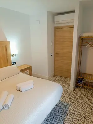 Cama o camas de una habitación en Al-Qazeres Suites