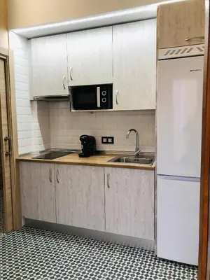Una cocina o zona de cocina en Al-Qazeres Suites