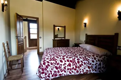 Cama o camas de una habitación en Casa Rural Aquilamas