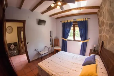 Cama o camas de una habitación en Casas Rurales El Caminante