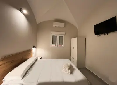 Una televisión o centro de entretenimiento en Hostal Pompeya Merida