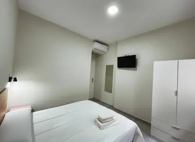 Cama o camas de una habitación en Hostal Pompeya Merida