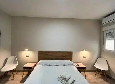 Cama o camas de una habitación en Hostal Pompeya Merida