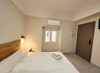 Cama o camas de una habitación en Hostal Pompeya Merida