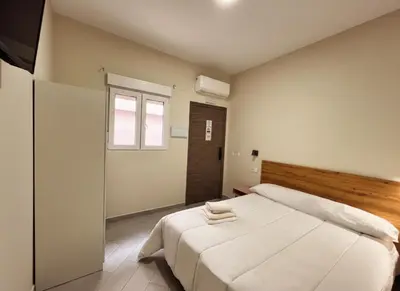 Cama o camas de una habitación en Hostal Pompeya Merida