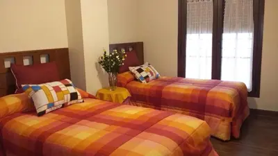 Cama o camas de una habitación en La plazuela Navaluenga