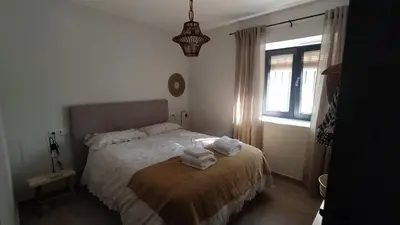 Cama o camas de una habitación en La Casa de Abajo