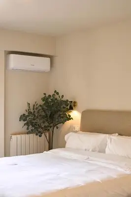 Cama o camas de una habitación en Apartamentos BEJAR - MUSGO