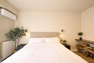 Cama o camas de una habitación en Apartamentos BEJAR - MUSGO