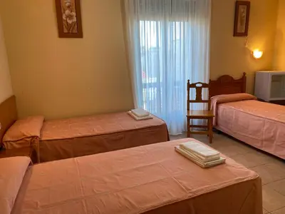 Cama o camas de una habitación en Hostal Jose Mari