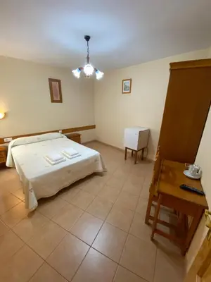 Cama o camas de una habitación en Hostal Jose Mari
