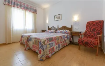Cama o camas de una habitación en Hotel La Glorieta