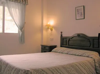Cama o camas de una habitación en Hotel La Glorieta