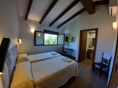 Cama o camas de una habitación en El Escudo de Calatrava Alojamiento 5 Estrellas Verdes