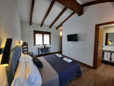 Cama o camas de una habitación en El Escudo de Calatrava Alojamiento 5 Estrellas Verdes