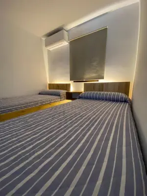 Cama o camas de una habitación en El 42 MIJARES