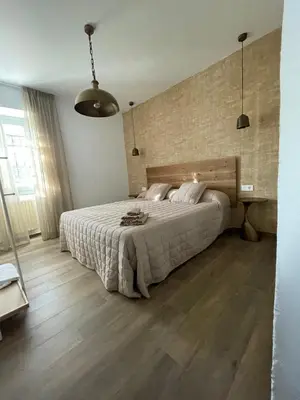 Cama o camas de una habitación en Casa Rural Camino de Hierro I y II