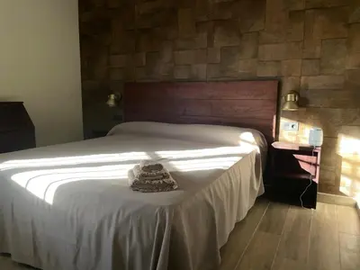 Cama o camas de una habitación en Casa Rural Camino de Hierro I y II