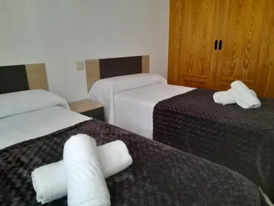 Cama o camas de una habitación en La Ronda