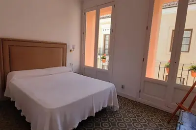 Cama o camas de una habitación en Tu alojamiento en Cáceres