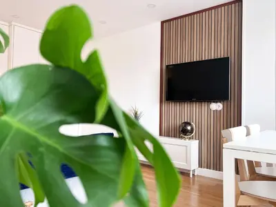 Una televisión o centro de entretenimiento en Duplex Ávila