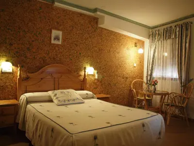 Cama o camas de una habitación en Hostal Yuste