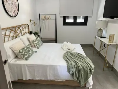 Cama o camas de una habitación en Apartamentos La Chimenea